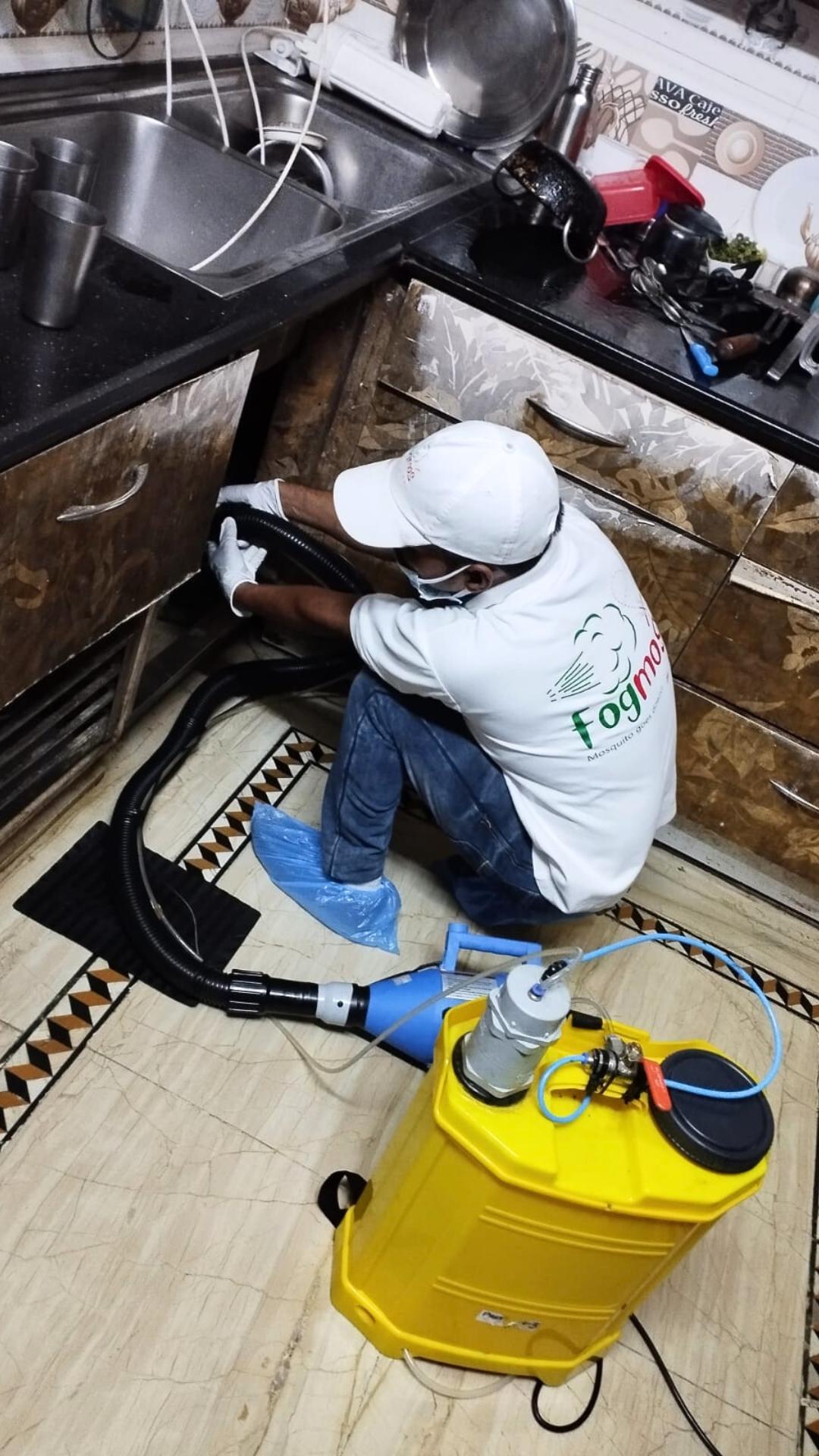 Fogmos technician treating kitchen area
